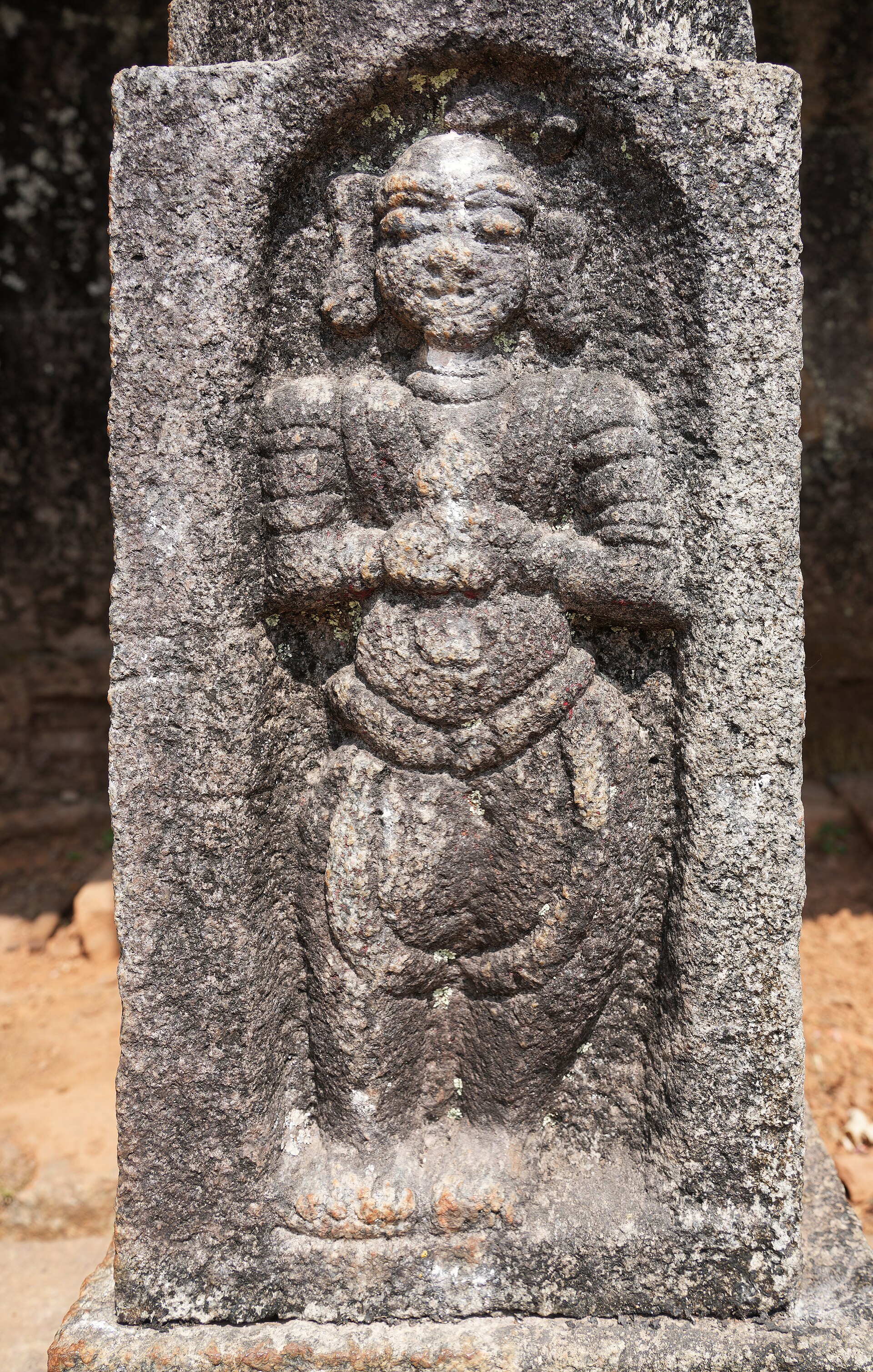 A carved deity on the temple wall